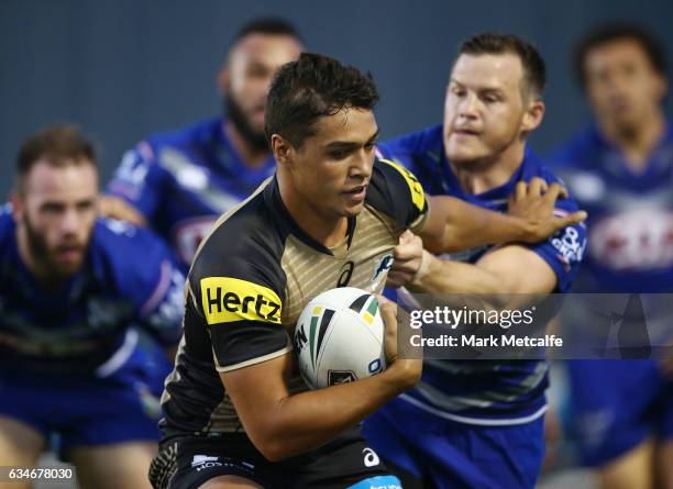 Te Maire Martin of the Panthers is tackled during the NRL Trial match between the Canterbury Bulldogs and the Penrith Panthers at Belmore Sports...