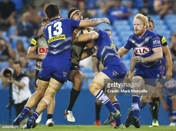 Sitaleki Akauola of the Panthers is tackled during the NRL Trial match between the Canterbury Bulldogs and the Penrith Panthers at Belmore Sports...