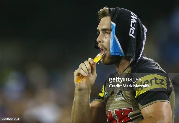 Kade Ellis of the Panthers cools down with a wet towel and an ice pole during the NRL Trial match between the Canterbury Bulldogs and the Penrith...