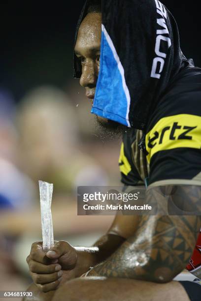 Dean Whare of the Panthers cools down with a wet towel and an ice pole during the NRL Trial match between the Canterbury Bulldogs and the Penrith...