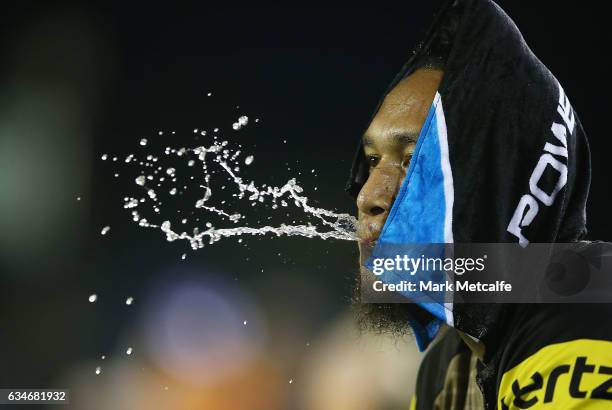 Dean Whare of the Panthers cools down with a wet towel during the NRL Trial match between the Canterbury Bulldogs and the Penrith Panthers at Belmore...