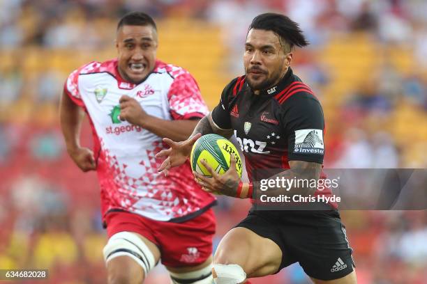 Digby Ioane of the Crusaders makes a break to score a try during the Rugby Global Tens match between Crusaders and Reds at Suncorp Stadium on...