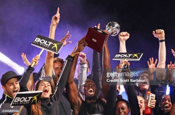 Usain Bolt and Usain Bolt's All-Star team celebrate with the trophy after winning the event during the Melbourne Nitro Athletics Series at Lakeside...