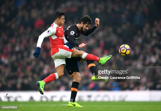 Andrea Ranocchia of Hull City and Alexis Sanchez of Arsenal compete for the ball during the Premier League match between Arsenal and Hull City at...