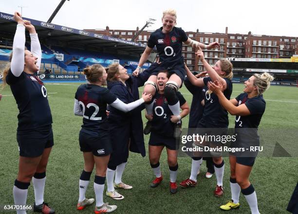Tamara Taylor of England is carried aloft by teammates after making her 100th appearance during the Womens Six Nations match between Wales and...