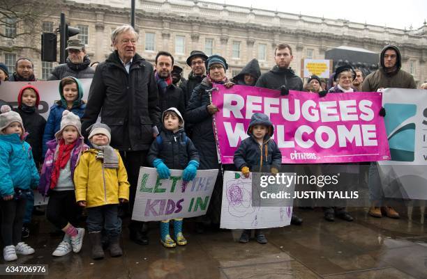 People gather to hear speeches on Whitehall before Lord Alf Dubs handed in a petition to 10 Downing Street calling on the Prime Minister to...