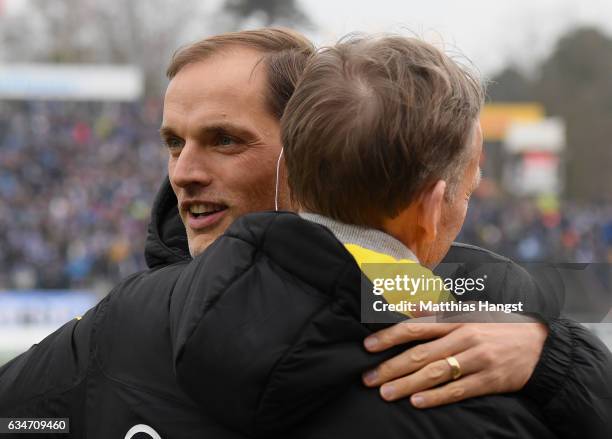 Head coach Thomas Tuchel of Dortmund shakes hands with Hans Joachim Watzke, CEO of Borussia Dortmund prior to the Bundesliga match between SV...