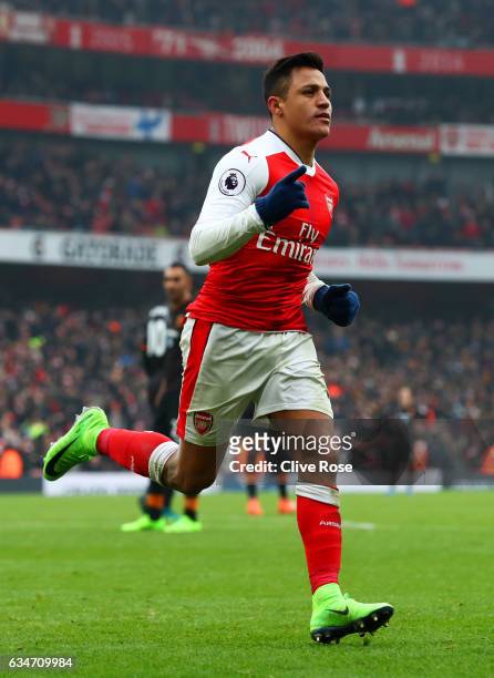 Alexis Sanchez of Arsenal celebrates scoring his side's second goal from the penalty spot during the Premier League match between Arsenal and Hull...