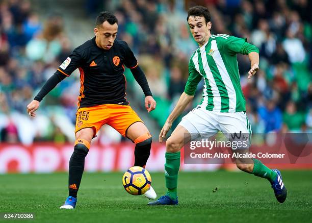 Fabian Orellana of Valencia CF being followed by Ruben Pardo of Real Betis Balompie during La Liga match between Real Betis Balompie and Valencia CF...