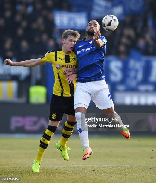 Matthias Ginter of Dortmund jumps for a header with Junior Diaz of Darmstadt during the Bundesliga match between SV Darmstadt 98 and Borussia...