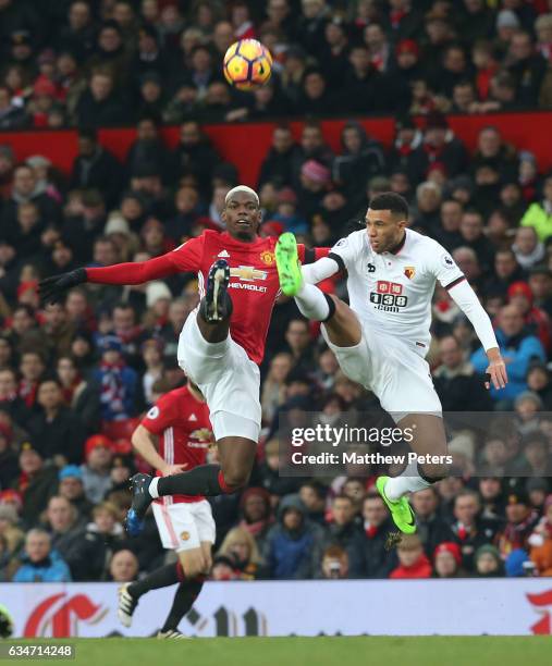 Paul Pogba of Manchester United in action with Etienne Capoue of Watford during the Premier League match between Manchester United and Watford at Old...