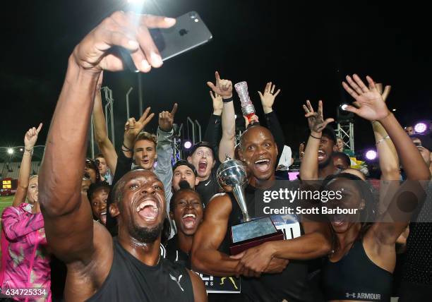 Usain Bolt, Asafa Powell and Usain Bolt's All-Star team celebrate with the trophy after winning the event during the Melbourne Nitro Athletics Series...