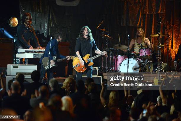 Musicians Rami Jaffee, Chris Shiflett, Dave Grohl and Taylor Hawkins of The Foo Fighters perform onstage during the 2017 MusiCares Person of the Year...