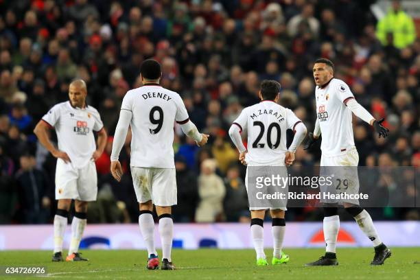 Younes Kaboul, Troy Deeney, Mauro Zarate and Etienne Capoue of Watford show their dejection after Manchester United's second goal during the Premier...