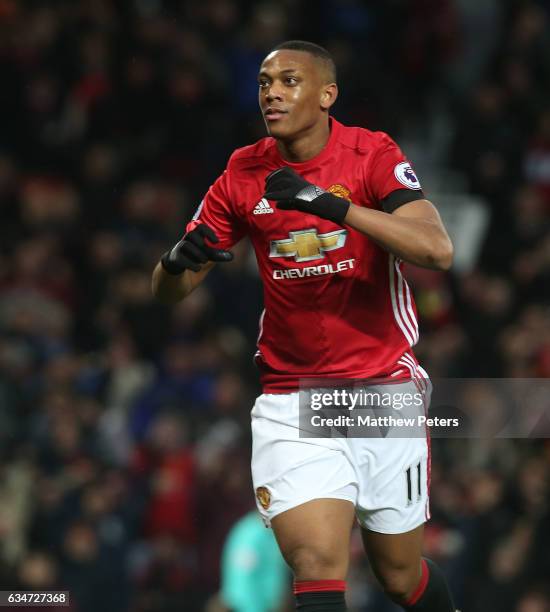 Anthony Martial of Manchester United celebrates scoring their second goal during the Premier League match between Manchester United and Watford at...