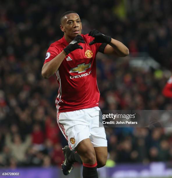 Anthony Martial of Manchester United celebrates scoring their second goal during the Premier League match between Manchester United and Watford at...