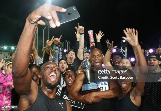 Usain Bolt, Asafa Powell and Usain Bolt's All-Star team celebrate with the trophy after winning the event during the Melbourne Nitro Athletics Series...