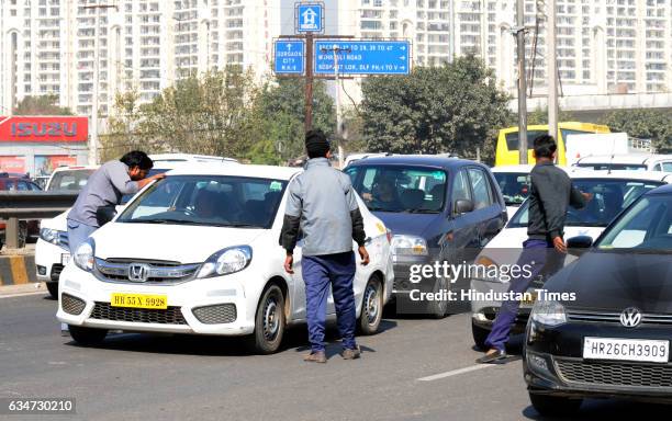 The app-based cab operators forced to observe the strike at Subash Chowk Sohna Road, on February 11, 2017 in Gurgaon, India. The drivers are...