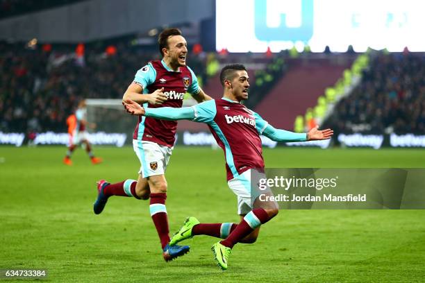 Manuel Lanzini of West Ham United celebrates scoring his side's second goal with his team mate Mark Noble during the Premier League match between...