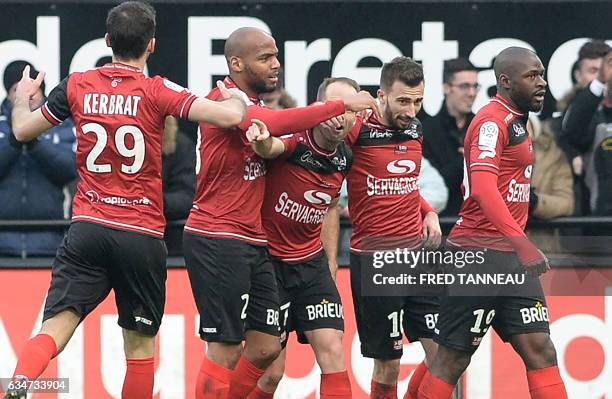 Guingamp's French defender Nicolas Benezet celebrates with his teammates after scoring a goal during the French Ligue 1 football match between...