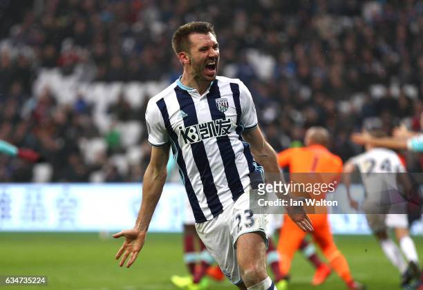 Gareth McAuley of West Bromwich Albion celebrates scoring their second goal to make it 2-2 during the Premier League match between West Ham United...