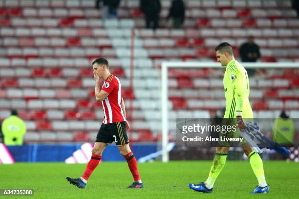 Cedric Soares and Vito Mannone of Sunderland leave the pitch after their 0-4 defeat in the Premier League match between Sunderland and Southampton at...