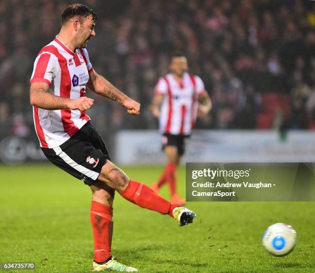 Lincoln City's Matt Rhead scores his sides third goal during the Vanarama National League match between Lincoln City and Woking at Sincil Bank...