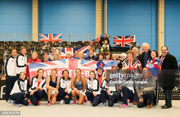 Jocelyn Rae, Heather Watson, captain Anne Keothavong, Laura Robson and Johanna Konta of Great Britain celebrate with fellow team members after the...