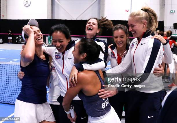 Johanna Konta of Great Britain celebrates with captain Anne Keothavong , Jocelyn Rae , Heather Watson and Laura Robson after the Fed Cup...