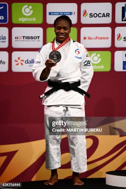 French Clarisse Agbegnenou poses with her silver medal on the podium of the -63 kgs, on February 11, 2017 at the Accord Hotels Arena in Paris, during...
