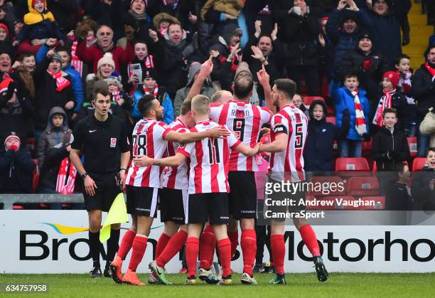 Lincoln City's Matt Rhead celebrates scoring the opening goal with team-mates during the Vanarama National League match between Lincoln City and...