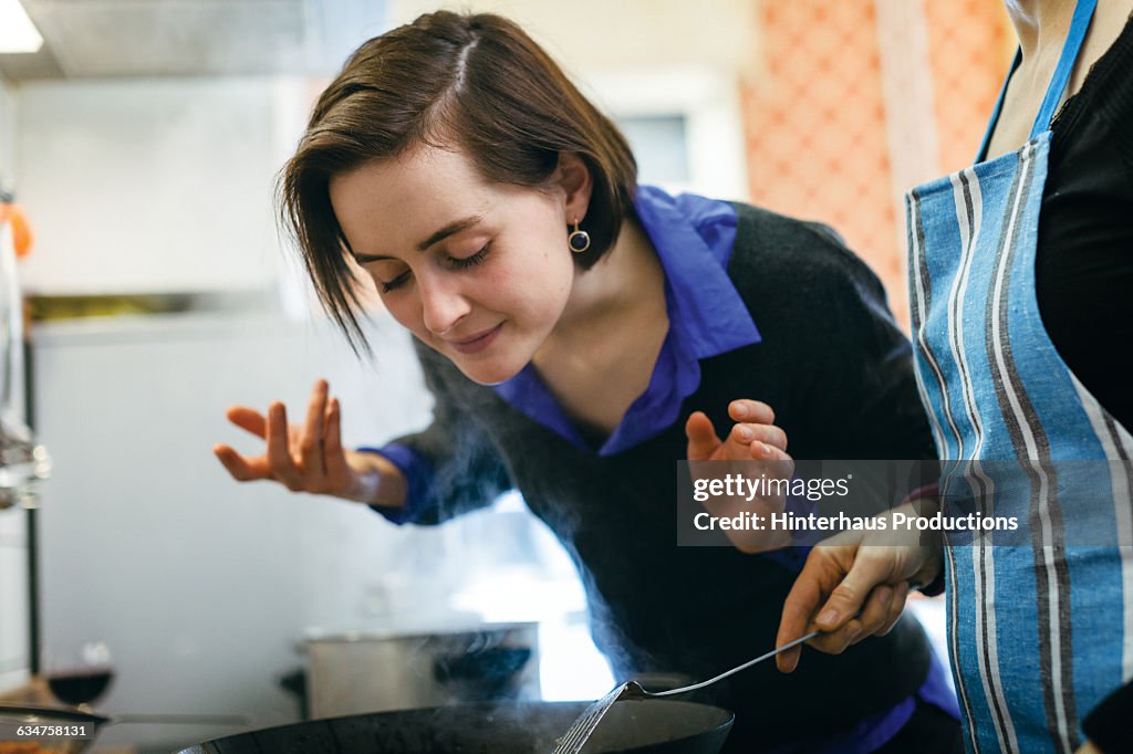 Woman smelling food
