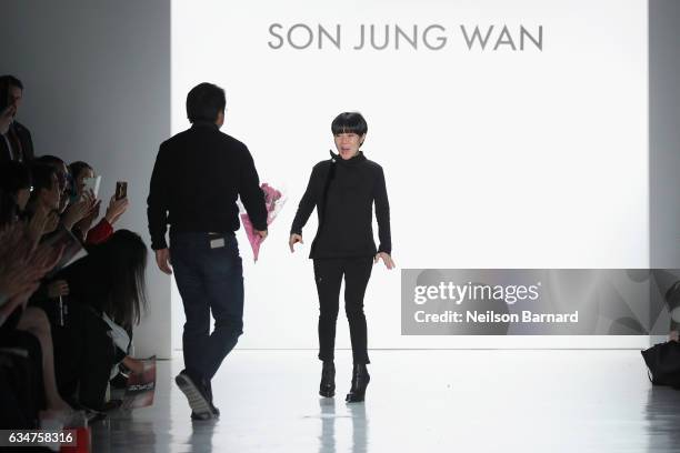 Designer Son Jung Wan receives flowers on the runway of the Son Jung Wan collection during, New York Fashion Week: The Shows at Gallery 3, Skylight...