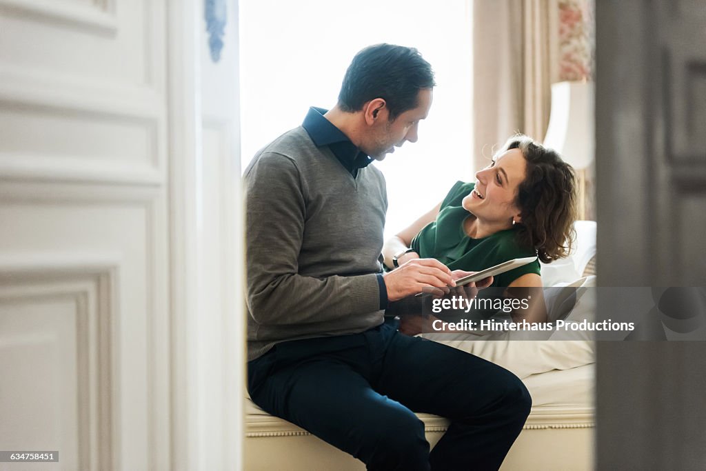 Mature couple having a good time in hotel room