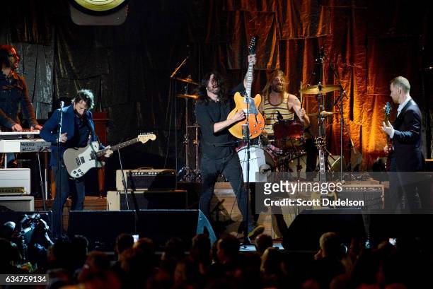 Musicians Rami Jaffee, Chris Shiflett, Dave Grohl and Taylor Hawkins of The Foo Fighters perform onstage during the 2017 MusiCares Person of the Year...
