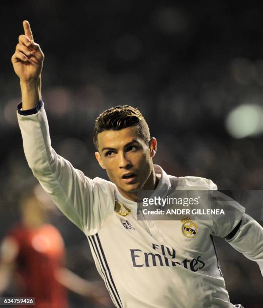 Real Madrid's Portuguese forward Cristiano Ronaldo celebrates after scoring his team's first goal during the Spanish league football match CA Osasuna...