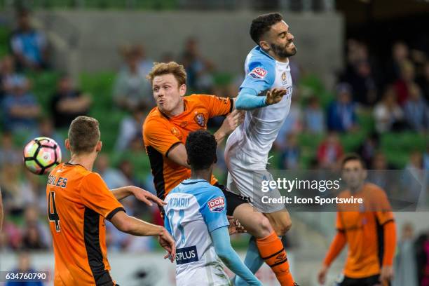 Corey Brown of the Brisbane Roar heads the ball in a contest with Anthony Caceres of Melbourne City during the round 19 match of the Hyundai A-League...