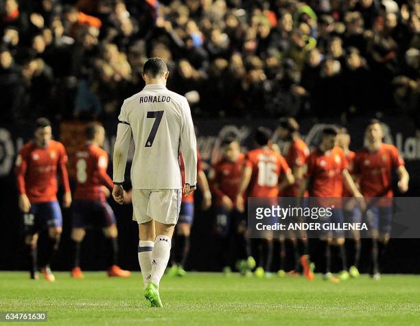 Real Madrid's Portuguese forward Cristiano Ronaldo walks after a goal by Osasuna during the Spanish league football match CA Osasuna vs Real Madrid...