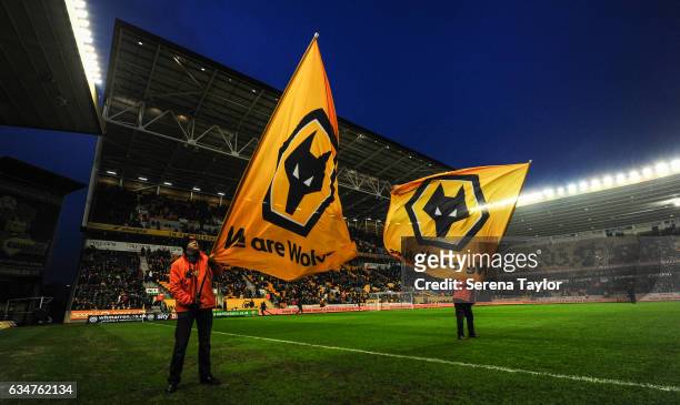 Wolverhampton Wanderers flag bearers wave their flags during the Sky Bet Championship match between Wolverhampton Wanderers and Newcastle United at...