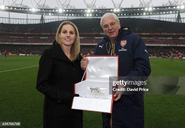 Recently retired Kelly Smith of Arsenal Ladies is presented with a Cannon by the Arsenal Chairman Sir Chip Keswick during half time at the Premier...