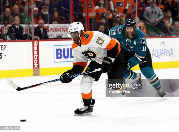 Wayne Simmonds of the Philadelphia Flyers breaks away as Joe Thornton of the San Jose Sharks defends in overtime against the San Jose Sharks on...