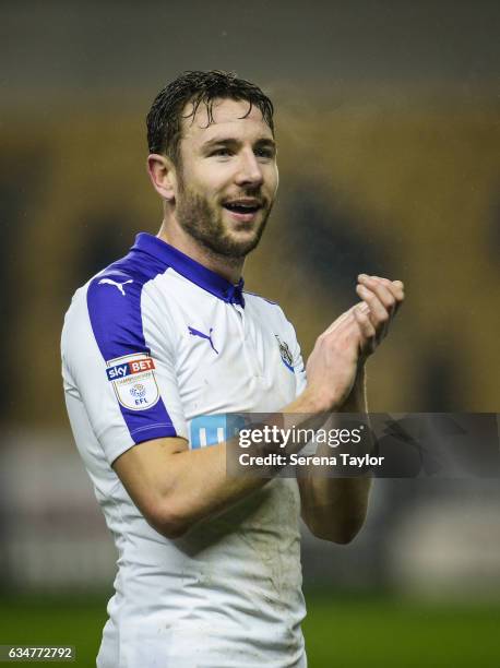 Paul Dummett of Newcastle United claps the fans after Newcastle win the Sky Bet Championship match between Wolverhampton Wanderers and Newcastle...