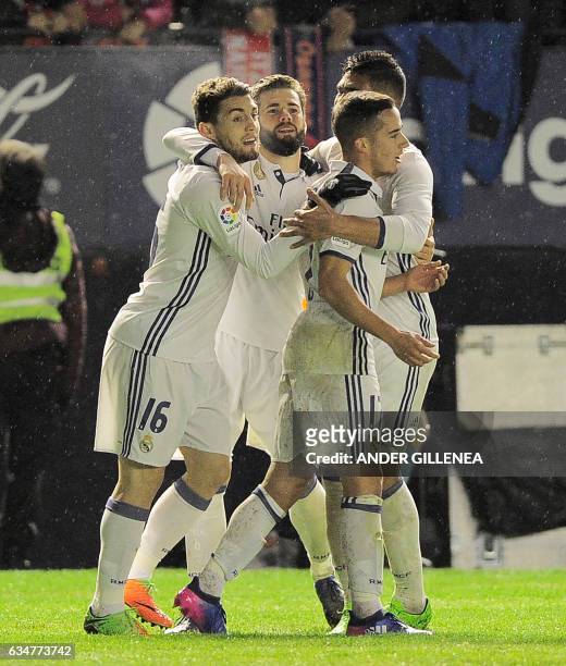 Real Madrid's players celebrate after the team's third goal during the Spanish league football match CA Osasuna vs Real Madrid CF at El Sadar stadium...