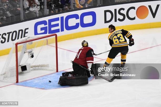 Brad Marchand of the Boston Bruins scores past Mike Smith of the Arizona Coyotes during the Discover Shootout as part of the 2017 Coors Light NHL...
