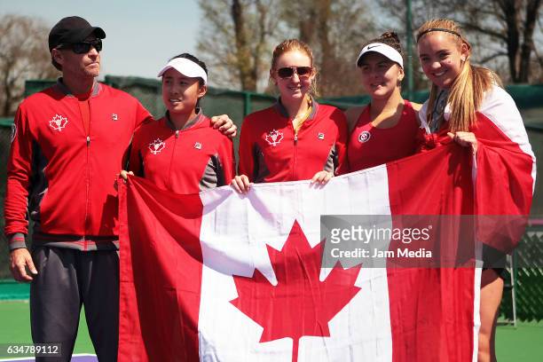 Sylvain Bruneau, Carol Zhao, Katherine Sebov, Bianca Andreescu and Charlotte Robillard-Millete of Canada hold a Canadian flag after the Fed Cup 2017...