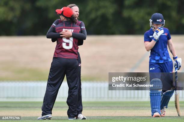 Lea Tahuhu of the Magicians is congratulated by Rachel Candy of the Magicians after dismissing Maddy Greenof the Hearts during the Women's One Day...