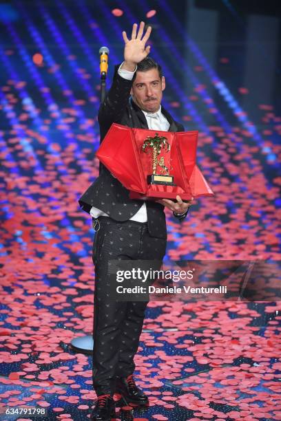 Italian singer Francesco Gabbani , winner of the 67th Italian Music Festival in Sanremo, pose with the award at Teatro Ariston on February 11, 2017...