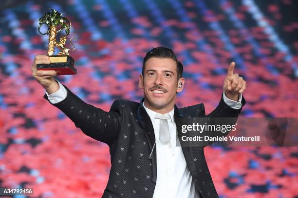 Italian singer Francesco Gabbani , winner of the 67th Italian Music Festival in Sanremo, pose with the award at Teatro Ariston on February 11, 2017...