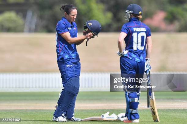 Sara McGlashan and Katie Perkins of the Hearts look on during the Women's One Day Final match between Canterbury Magicians and Auckland Hearts on...