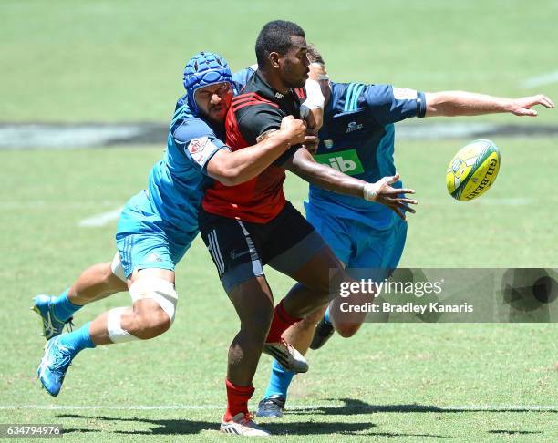 Poasa Waqanibau of the Crusaders gets a ball away during the Rugby Global Tens match between the Crusaders and Blues at Suncorp Stadium on February...